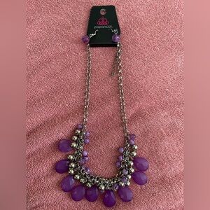 9 necklaces and a bag of beads